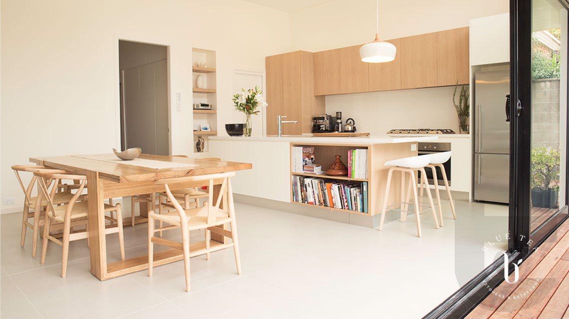Scandinavian Kitchen Design in Coogee, Sydney featuring timber and white cabinetry with a Scandinavian dining table and chairs.