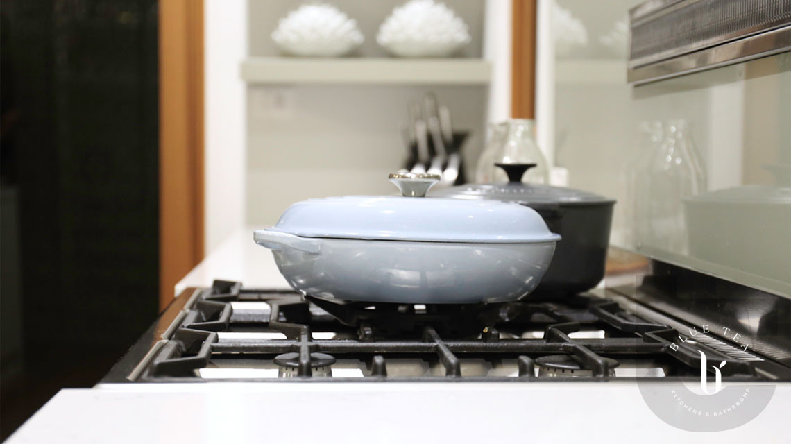 Cooktop details in Hunters hill with open shelves behind.
