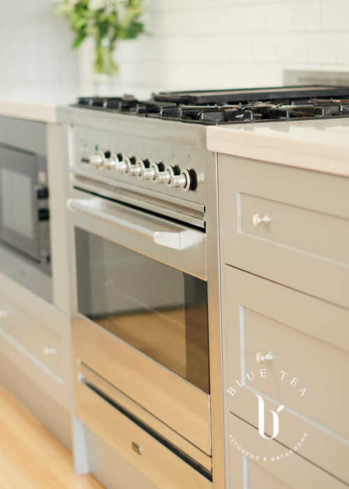 Hamptons Kitchen showcasing a close up of the oven details, with shaker cabinetry and a marble benchtop in Kensington.