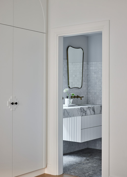 Bathroom entrance with detailed joinery at Woollahra bathroom