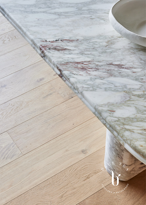 Curved marble island with double bullnose edge