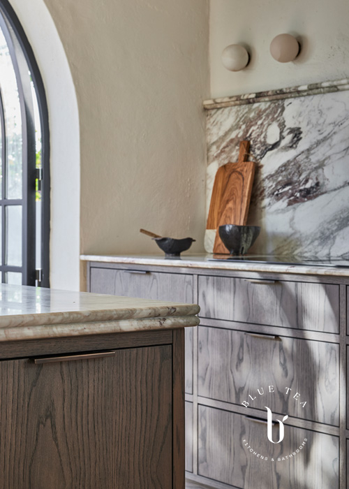 Woollahra timber kitchen with detailed drawers featuring brass handles