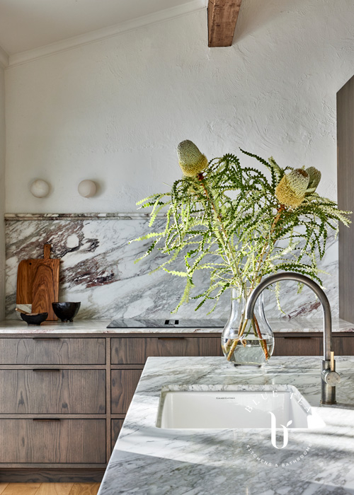 marble splashback and detailed timber drawers at Woollahra kitchen