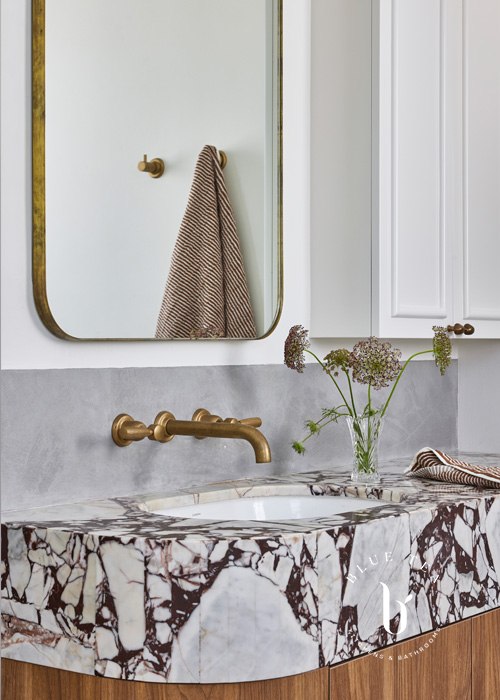 Vanity detail with Viola marble curved stone