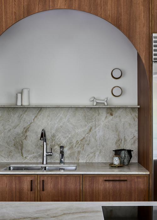 Curved joinery and petite feature wall lights in our Mosman kitchen