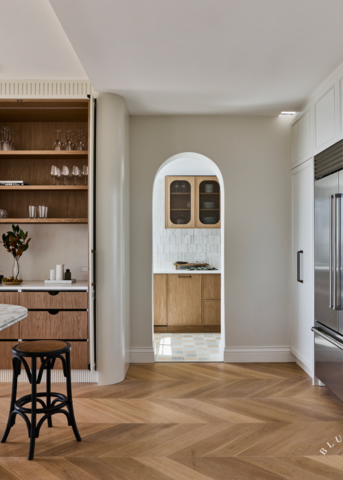 A hidden timber coffee nook sits next to a an arched entrance way into the butlers pantry at our Vaucluse project.