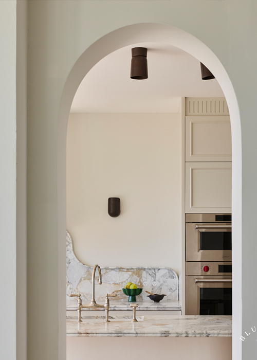 A curved entrance showing glimpses of stunning marble and detailed joinery at Vaucluse.